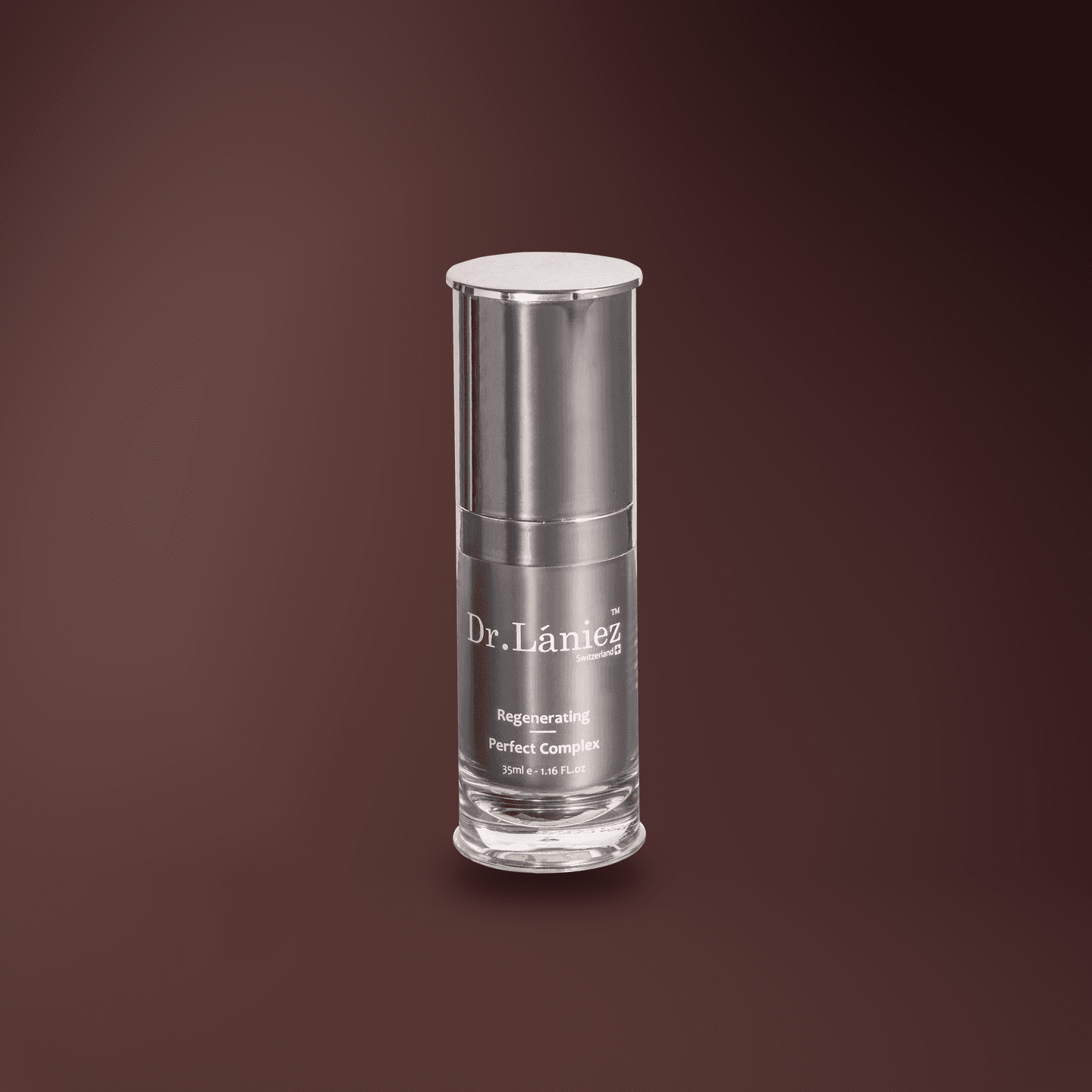 Graphite pump bottle of Regenerating Perfect Complex, 35 ml, lit on a warm plum studio backdrop.