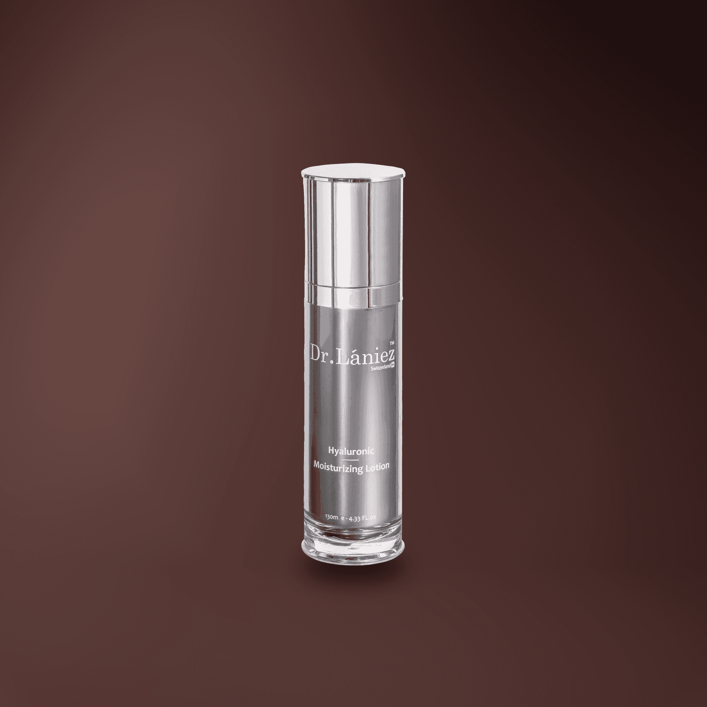 Silver pump bottle of Hyaluronic Moisturizing Lotion, 130 ml, lit on a warm plum studio backdrop.